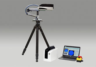 A tripod with the m-Laue mounted on it.