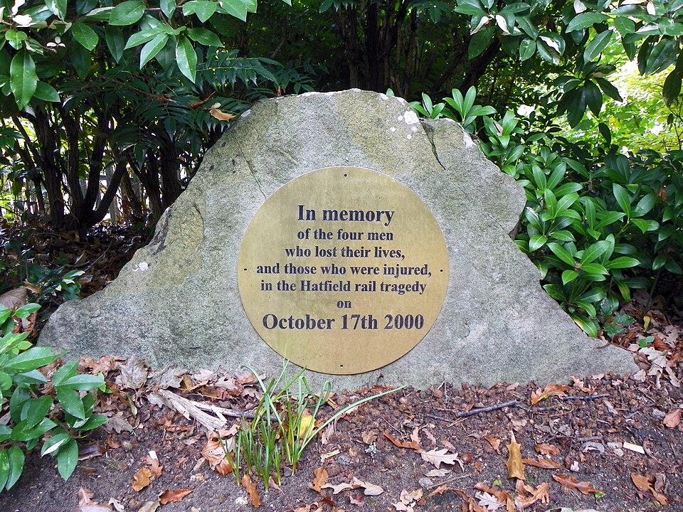 A memorial stone that reads "In memory of the four men who lost their lives, and those who were injured in the Hatfield rail tragedy on October 17th 2000